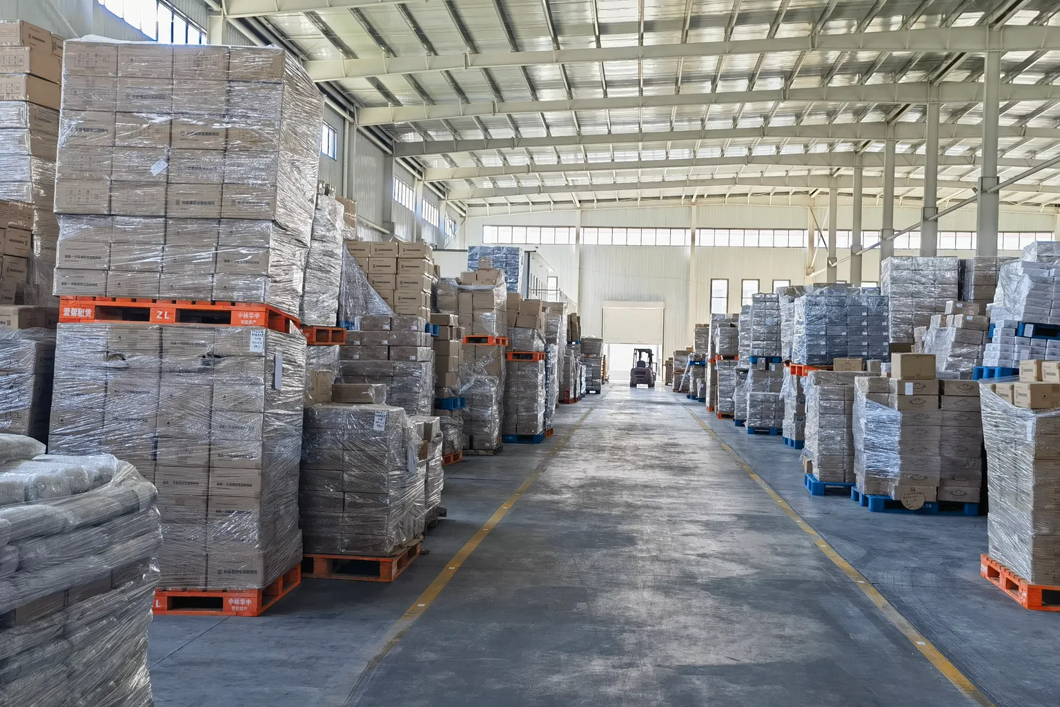 NEOO export warehouse — palletized orders ready for containers